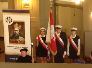 The color guard and a university banner with Kazimierz the Great on it.
